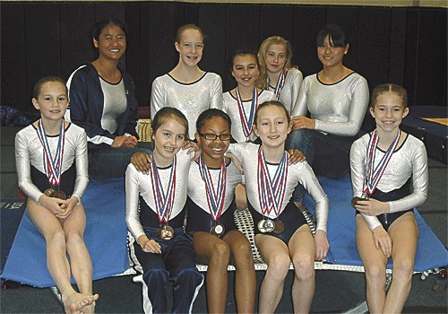 Members of the Island Flyers pose with their medals from the state tournament. Back row