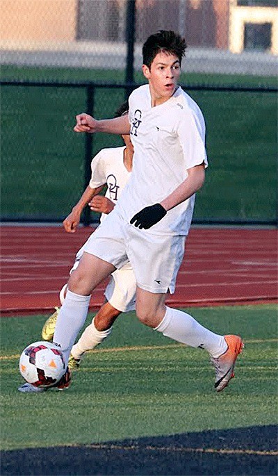 Oak Harbor's Eduardo Andrade looks to pass in Tuesday's match.