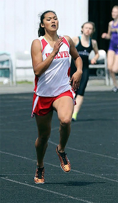 Makana Stone sprints to a win in the 400 meters Saturday.