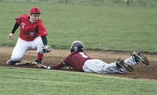 Coupeville's Drew Chan receives a throw from catcher Jake Tumblin and tags out a Lakewood runner attempting to steal second base Monday.