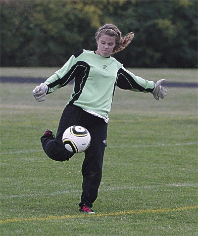 Grace LaPoint boots away the ball after recording a save.