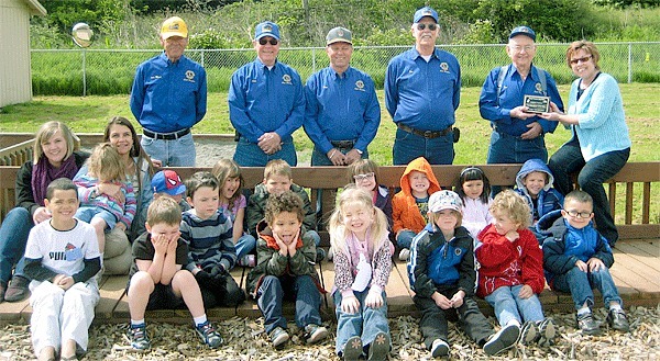 The Oak Harbor Lions Club stands with a Head Start preschool class. The teachers are Danni Chamberlain and Becki Brant. Betty Judd