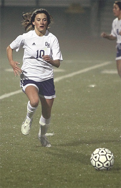 Maura McKole runs down the ball in Wednesday's match in foggy Wildcat Memorial Stadium.