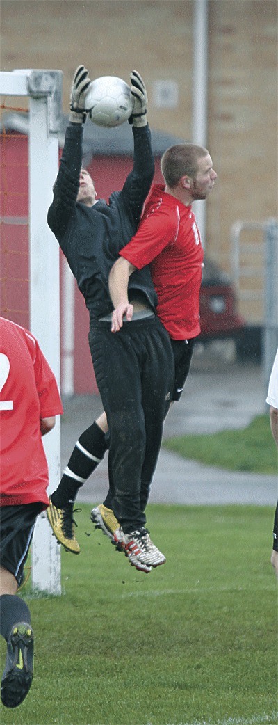 Coupeville's Zach Forland stops an Archbishop Murphy scoring attempt.