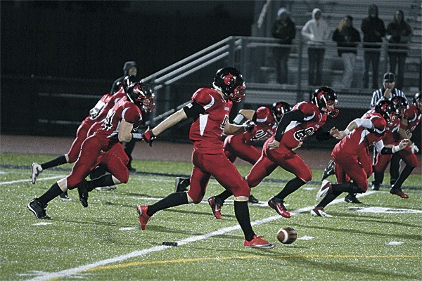 Kole Kellison and his Coupeville teammates attempt an onside kick against Meridian.