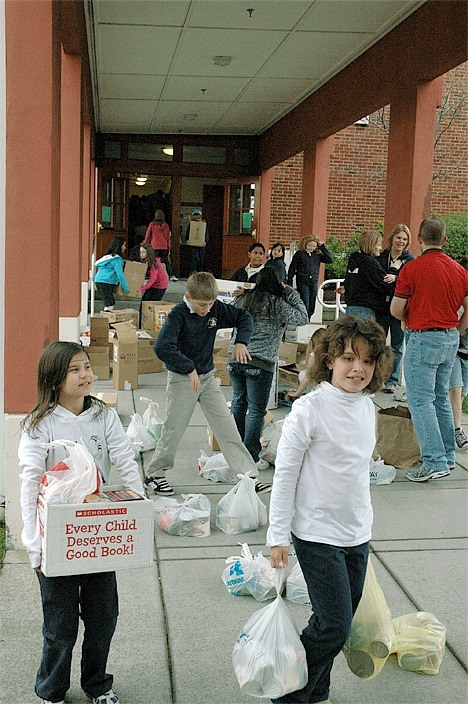 Students at Oak Harbor Elementary School gather their canned goods for the student-run drive to support the North Whidbey Help House.