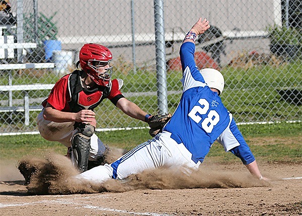 Coupeville catcher Cole Payne puts the tag on Chimacum's Lane Dotson in a game this spring. Payne was named the Olympic League's Most Valuable Player this week.