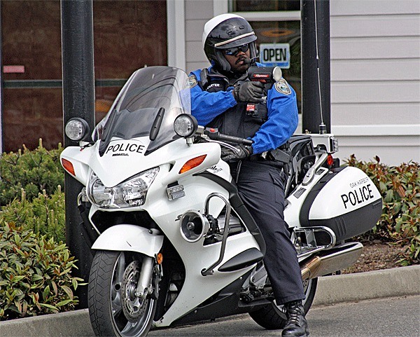 Oak Harbor Police Officer Serloyd Carter patrols for speeders on Highway 20.