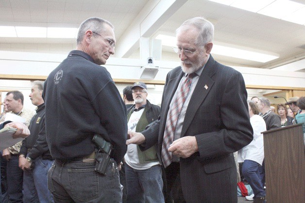 Oak Harbor City Councilman Jim Campbell speaks with John Laigaie