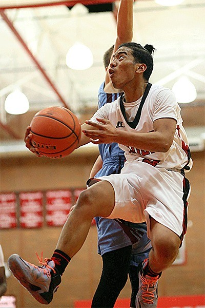 Coupeville's Risen Johnson flies to the basket in the Wolves' win over Stevenson.