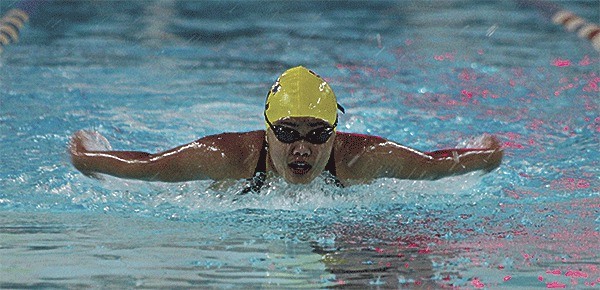 Tricia Desquitado swims to second place in the 100 butterfly Monday to help Oak Harbor defeat Stanwood.