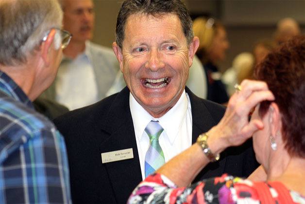 Mayor Bob Severns chats with luncheon attendees Thurday after delivering his first State of the City address since being elected.