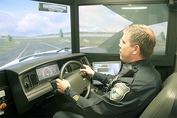 Oak Harbor Police Officer Dennis Dickinson tries out a state-owned driving simulator that’s supposed to help officers become better drivers.