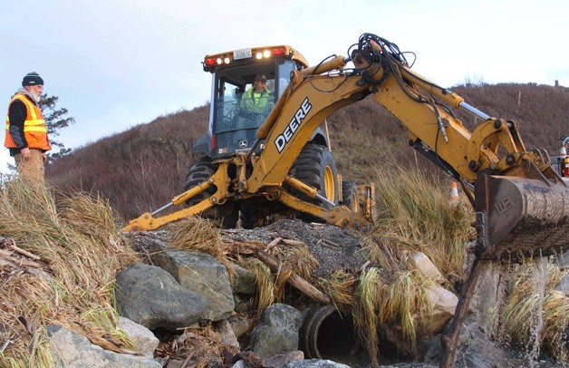 Island County Public Works employee Randy Chambers watches an excavator clear a storm drain obstruction near Ebey’s Landing last month.