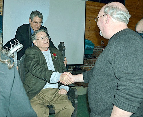 Wallie Funk shakes the hand of a well wisher during a celebration of his 90th birthday. Hundreds of people showed up for the birthday celebration that was sponsored by the community of Anacortes. Funk was the co-publisher and editor of the Whidbey News-Times and South Whidbey Record.