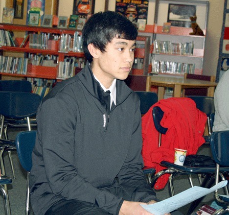 Newly appointed student representative Andre Stone sits as he is interviewed by Coupeville School Board members during a meeting at the Coupeville Elementary School library.