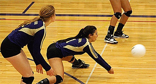 Aubrey Lock digs a serve against Marysville-Pilchuck Thursday.