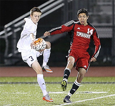 Oak Harbor's Nathan Merrill (3) stops the ball in front of M-P's Marco Reyes-Navarro.