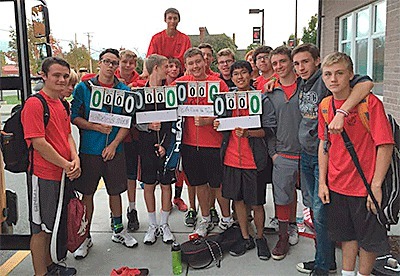 The Coupeville tennis team presented a new set of scorecards for the CHS courts to coach Ken Stange Thursday.