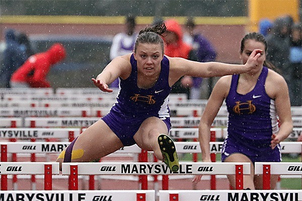 Kaitlyn Chelberg zips to a win in the 100 hurdles Thursday. She also claimed first in the 30 hurdles.