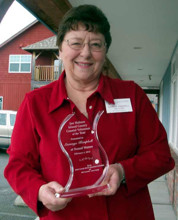 Coupeville resident Sammye Kempell displays the Jan Holmes Island County Coastal Volunteer of the year Award.