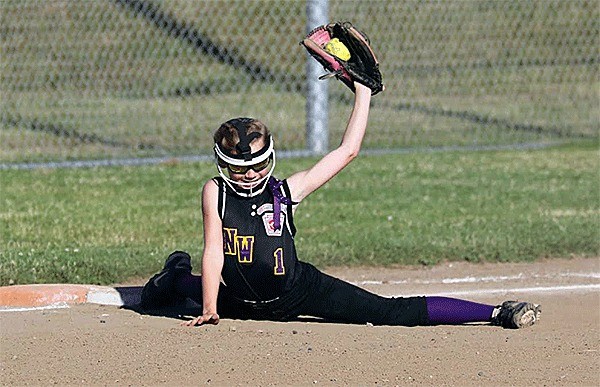 North Wbidbey's Emily Wilson stretches for an out in last summer's district tournament play. Wilson and the NWLL 11/12 all-star sofball team begins the 2016 postseason Monday.