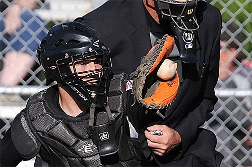 North Whidbey's Keygan Kesgard looks in a pitch in Tuesday's championship game.