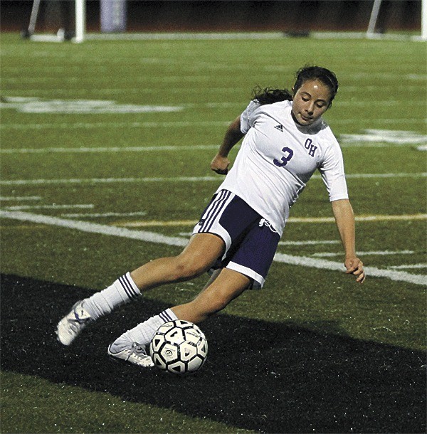 Mckenzie Schneider turns the ball up field in Oak Harbor's tie with Lynnwood.