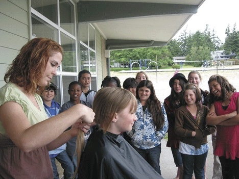 Nathan Richardson draws a crowd outside of the school.