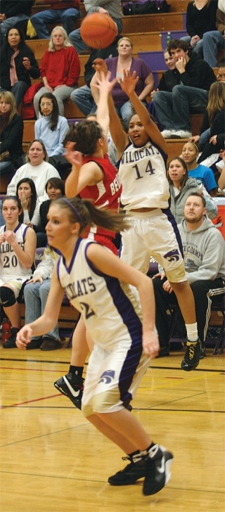 Oak Harbor’s Jessica Denmon gets off a shot from 3-point range. Denmon scored a team-high 18 points in the 54-49 loss.