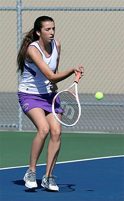 Tamia Rios returns a shot in her third singles win Wednesday.