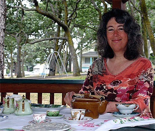 Oak Harbor resident Melissa Duffy enjoys green tea while sitting at a picnic table inside the Smith Park gazebo. She will be hosting a public tea ceremony this Sunday