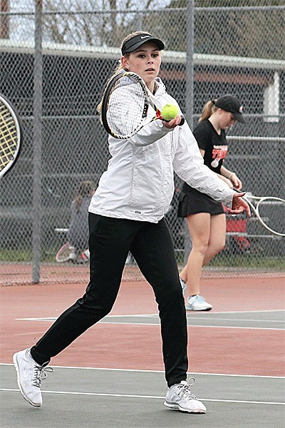 Payton Aparicio returns a shot in her match Monday. She teamed with Sage Renninger to win first double.