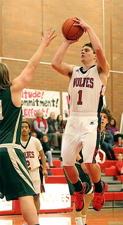 Wiley Hesselgrave puts up a jumper in the win over Klahowya. Hesselgrave hit two free throws in the final 20 seconds to give Coupeville the lead and paced the Wolves with 20 points.