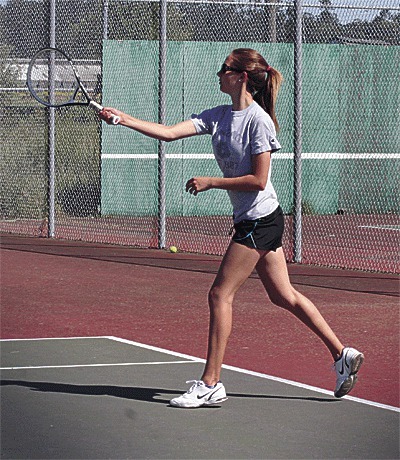 Allie Hanigan returns a shot in the tri-district play-in match Monday.