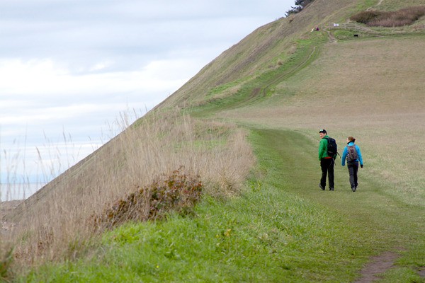 Tobin Ziel and Caya Johnson set out for a hike on the bluff at Ebey’s Landing State Park Feb. 2. It was Ziel’s first time there. ‘It’s beautiful