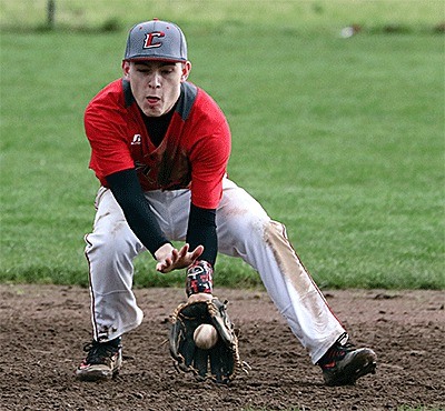 Shortstop C.J. Smith scoops up a ground ball in Monday's game.