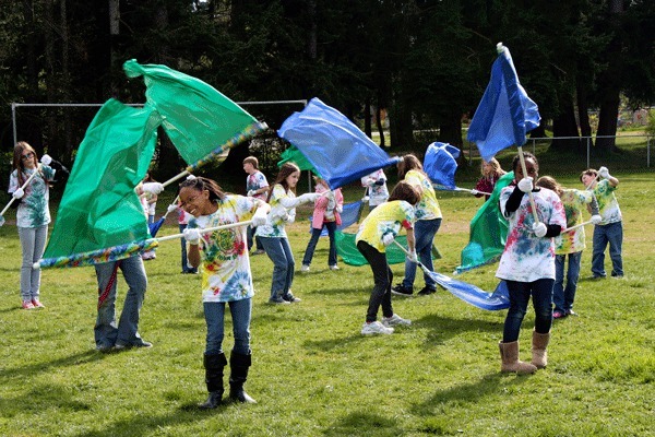 Broad View Elementary School’s flag team practices their routine on the playground last week. The group will perform two numbers during the Holland Happening parade on Saturday.