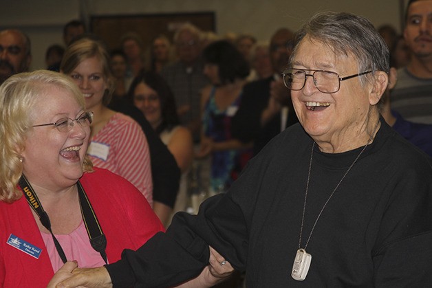 Oak Harbor Chamber of Commerce Director Kathy Reed congratulates Wallie Funk on receiving a Lifetime Achievement Award presented by the Whidbey News-Times. Funk was the owner and publisher of the Whidbey News-Times and South Whidbey Record from 1964-89.