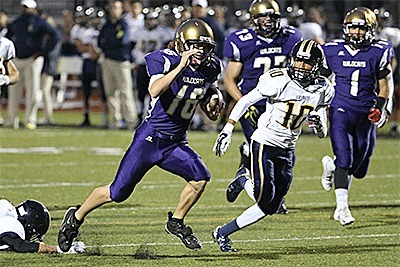 Quarterback Tyler Snavely breaks loose for a 22-yard TD run Friday.