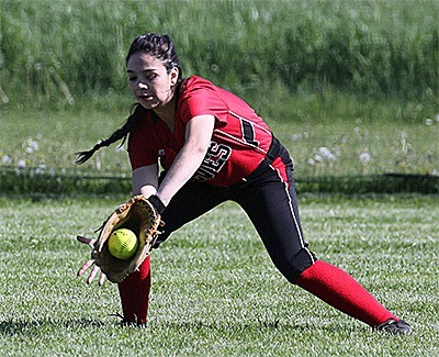 Coupeville right fielder Robin Cedillo fields a Chimacum hit Monday.