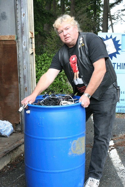 Oak Harbor VFW Senior Vice Post Cmdr. Myron Brundage shows a barrel of wire left behind by thieves.