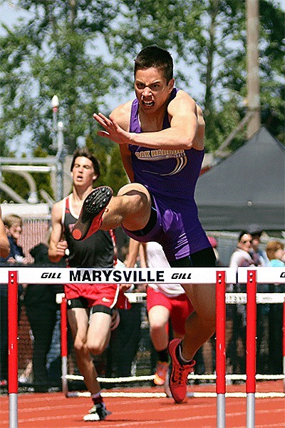 Jared Gray runs to first place in the 300 hurdles. He also won the 110 hurdles Saturday.