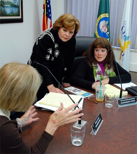 Members of the Oak Harbor Arts Commission discuss budget numbers following their recommendation for four works of art for the downtown area on Pioneer Way. From the left are Nora O’Connell-Balda