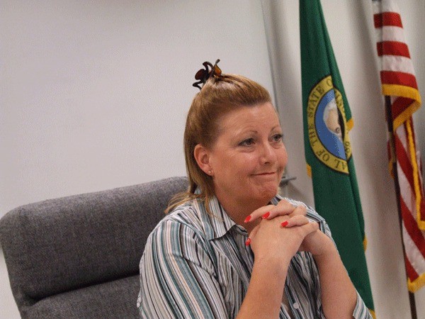 Commissioner Kelly Emerson listens to county 2014 budget discussions at a September work session for the board.