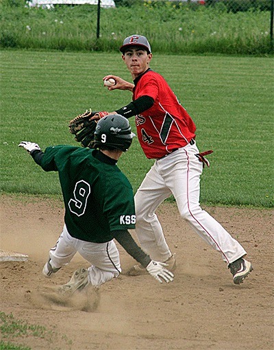 Coupeville's Hunter Smith avoids the slide of Klahowya's Tanyr Gagnon to throw to first to complete a double play.