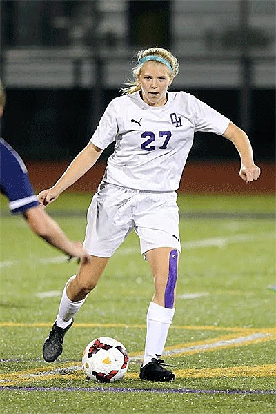 Lydia Peplinski looks for a passing lane in Monday's match with Arlington. Peplinski scored the Wildcats' only goal in the match.