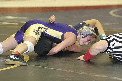 Kylene Ayer pins Ashley Becerra of Burlington in the regional tournament Saturday.