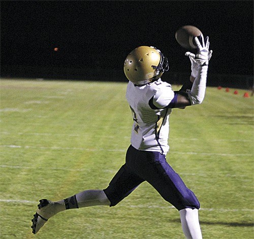 JoJo Webster hauls in a PAT pass from Ian Kolste in Oak Harbor's win over Arlington.