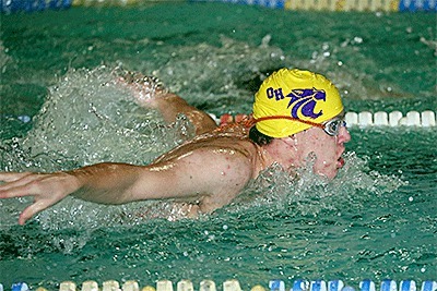 Garrett Karney swims to fourth place in the 200 individual medley in Oak Harbor's win over Monroe Monday.